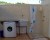 spazio esterno con lavatrice e doccia